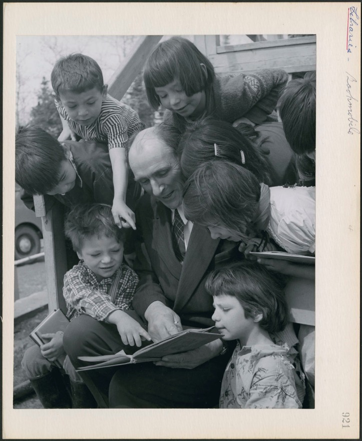 Librarian reads to a group of children in Northern Ontario, Canada (1930-1960) Credit: Canada. Dept. of Manpower and Immigration / Library and Archives Canada